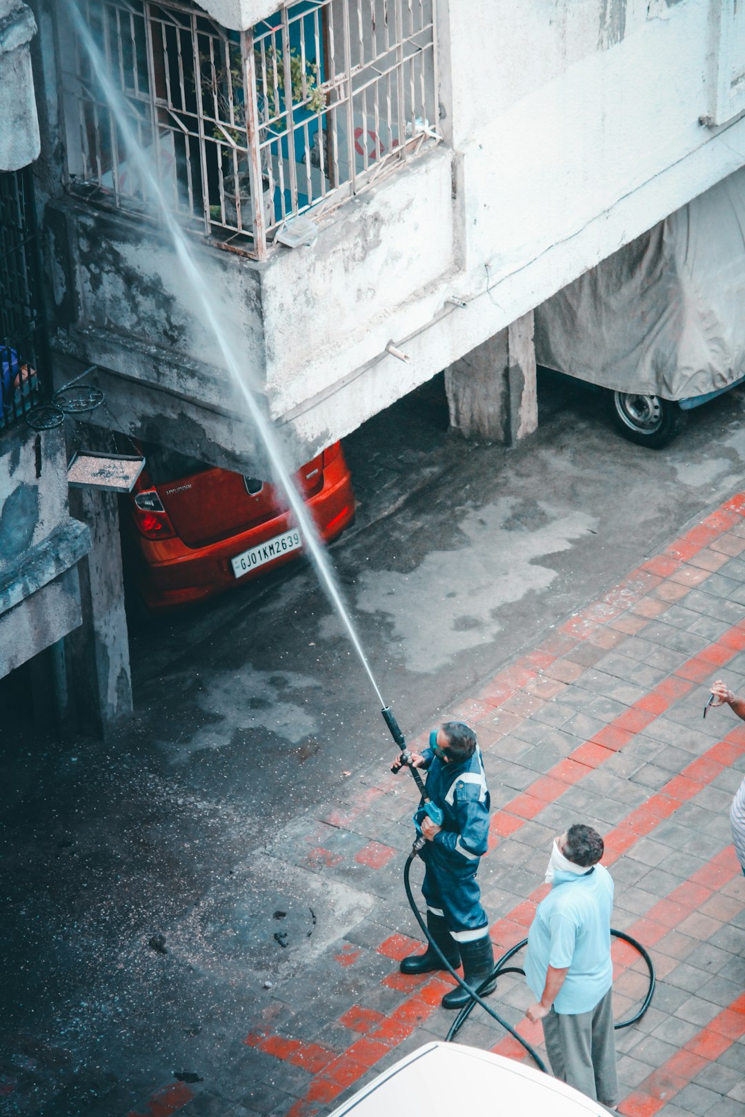 man-in-white-long-sleeve-shirt-and-blue-denim-jeans-holding-black-and-white-stick-walking-lkgejvkeca0